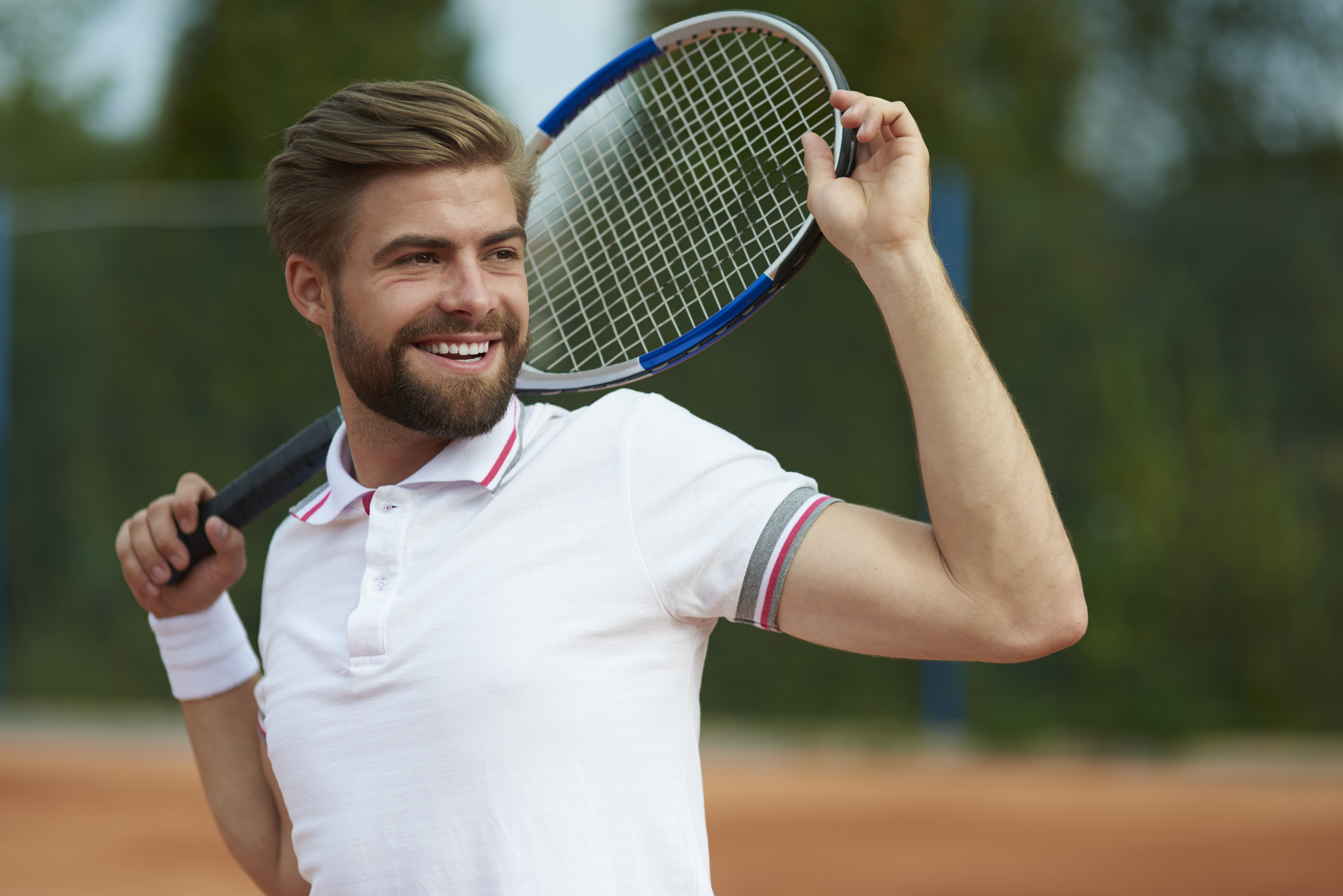 Tennis player looking away on the court